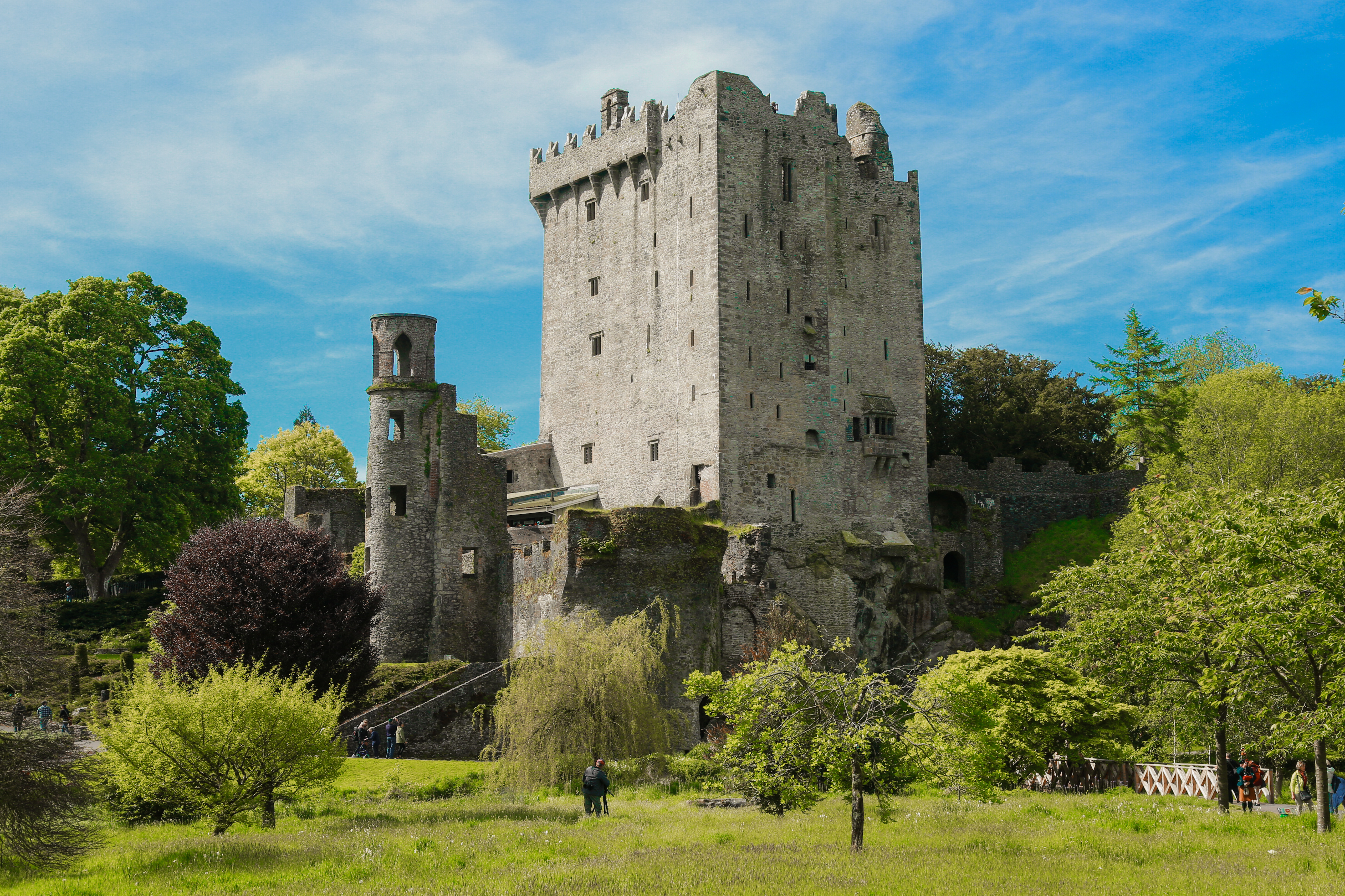 Stone castle tower on a green hillside