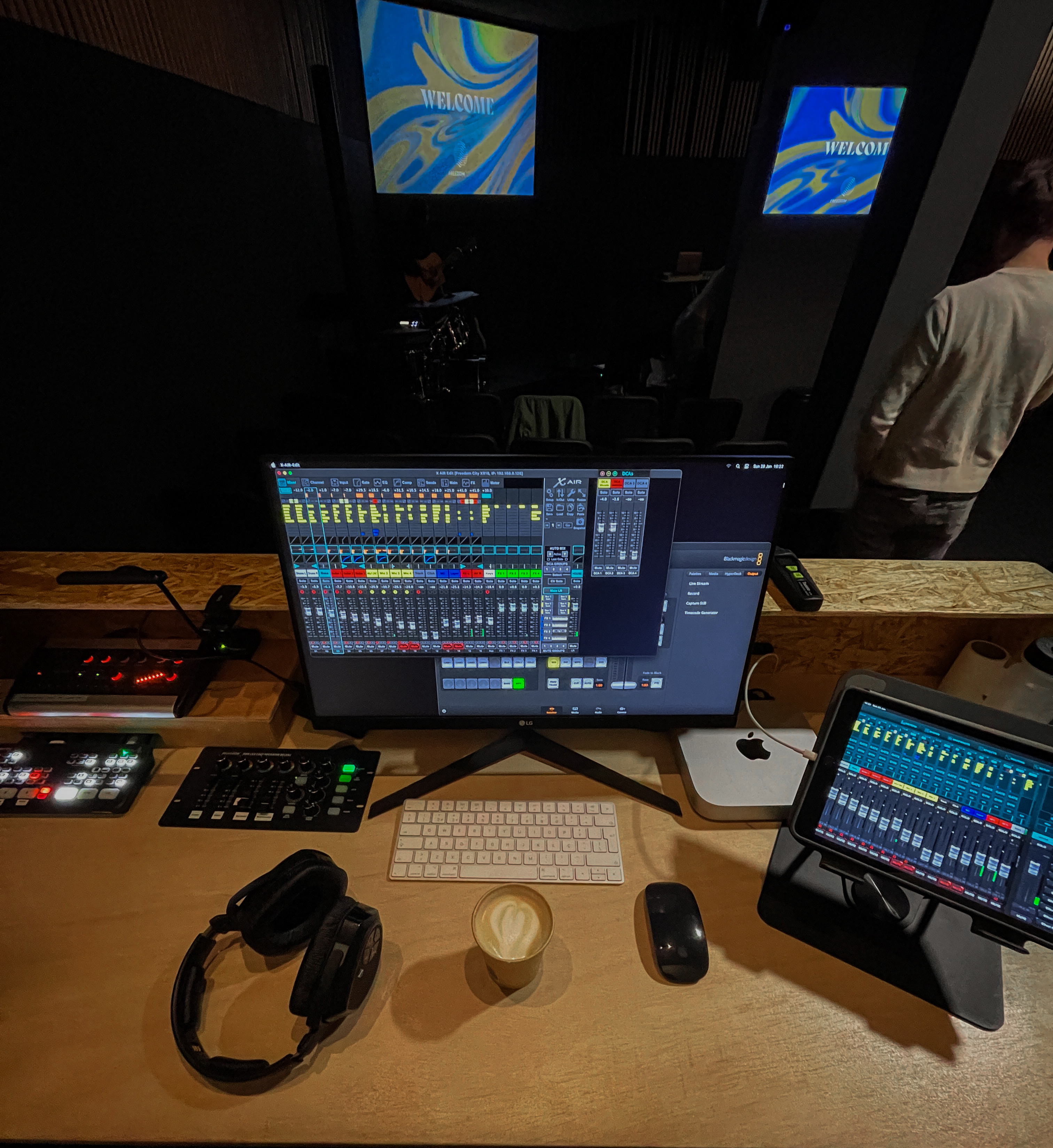 Audio desk with headphones, laptop and sound meter