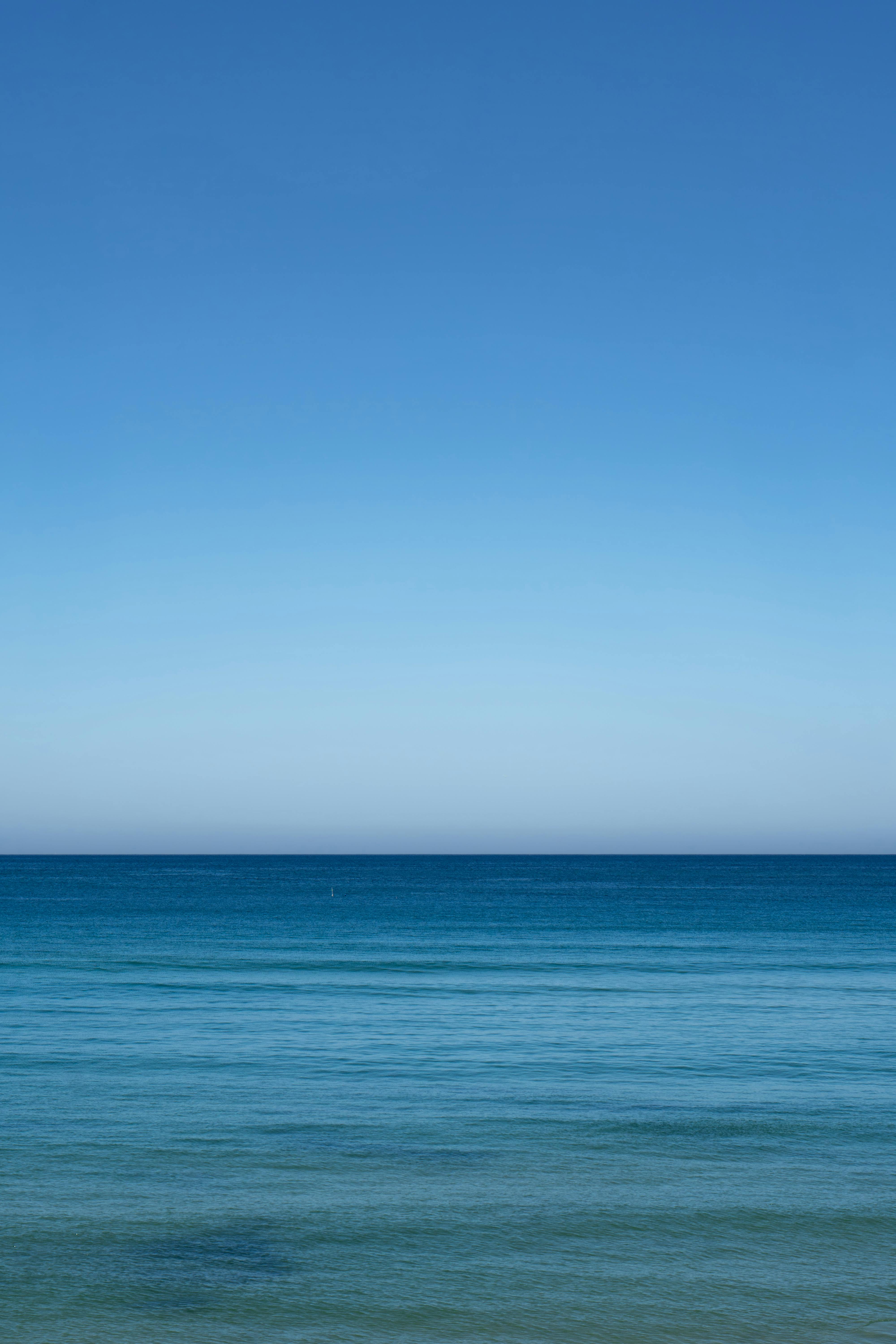 Calm blue sea under a clear sky